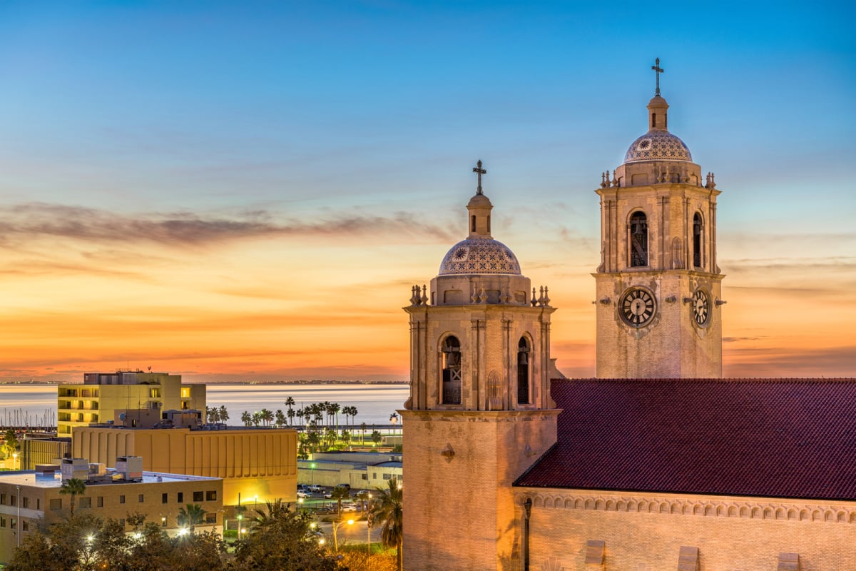 Corpus Christi Cathedral backdropped by palm trees